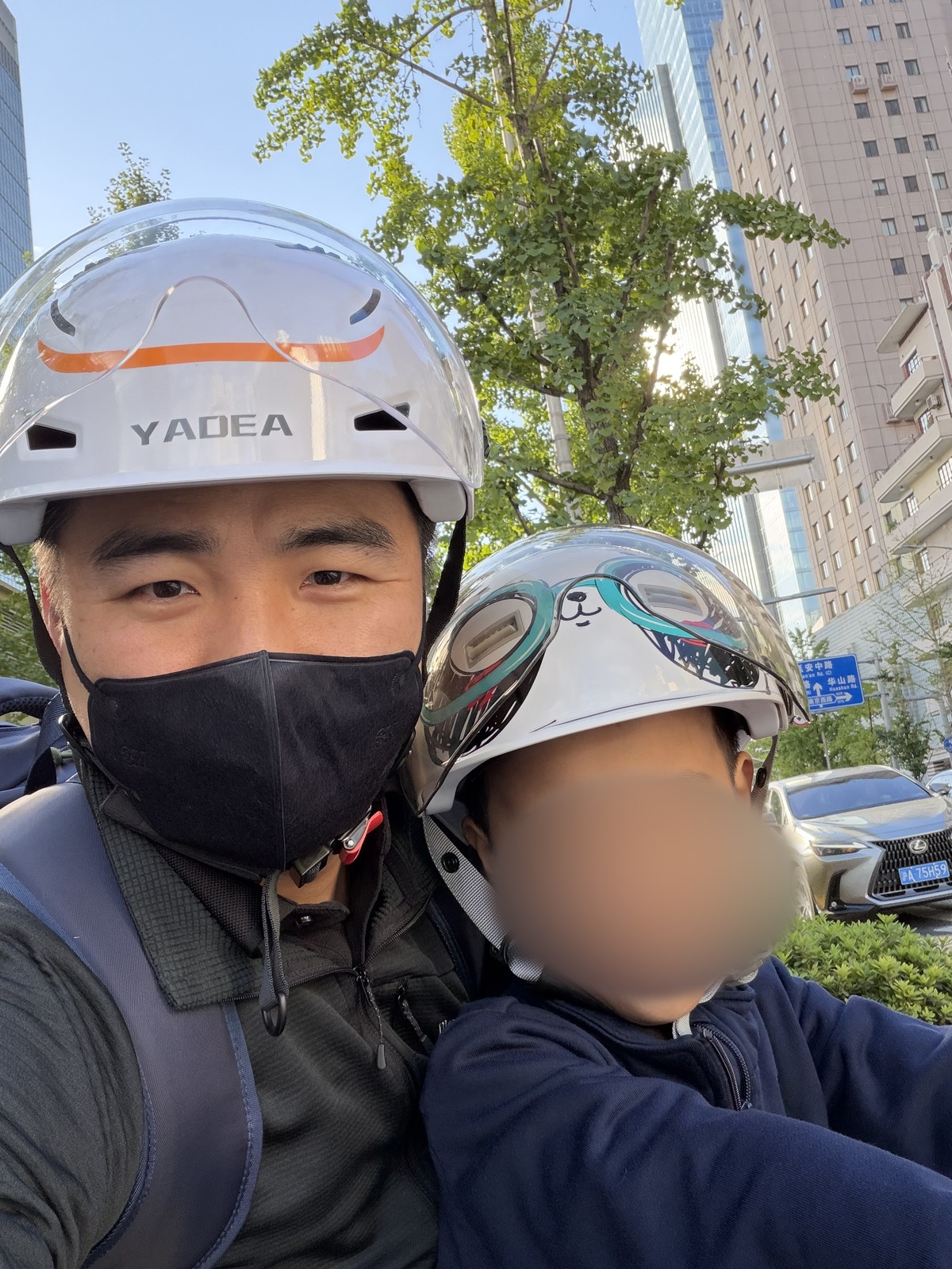 E-bike classroom: helmets on the road (child’s face obscured)